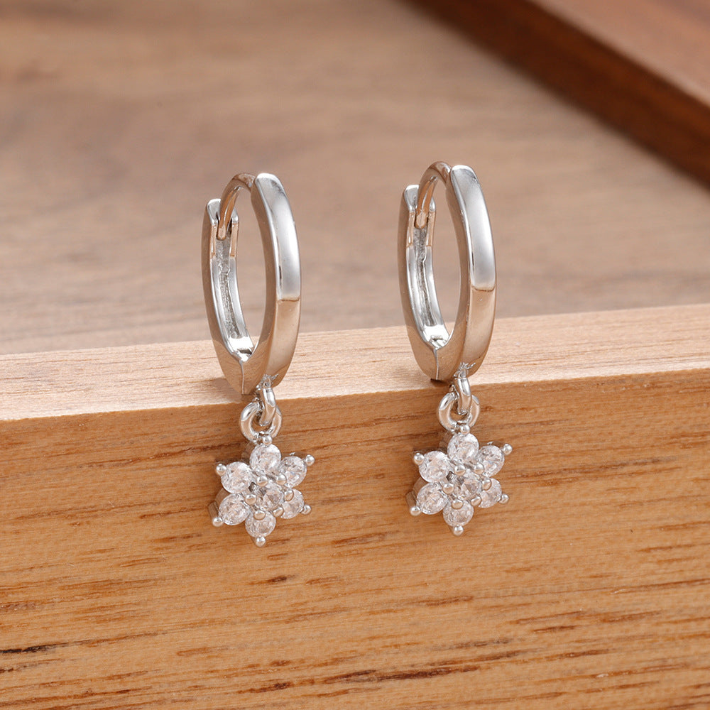 Boucles d’oreilles géométriques à fleurs