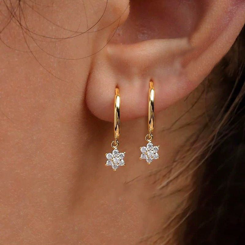 Boucles d’oreilles géométriques à fleurs